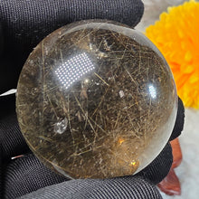 Load image into Gallery viewer, Golden Rutiles in Smoky Quartz Sphere – 金发晶烟晶圆球摆件
